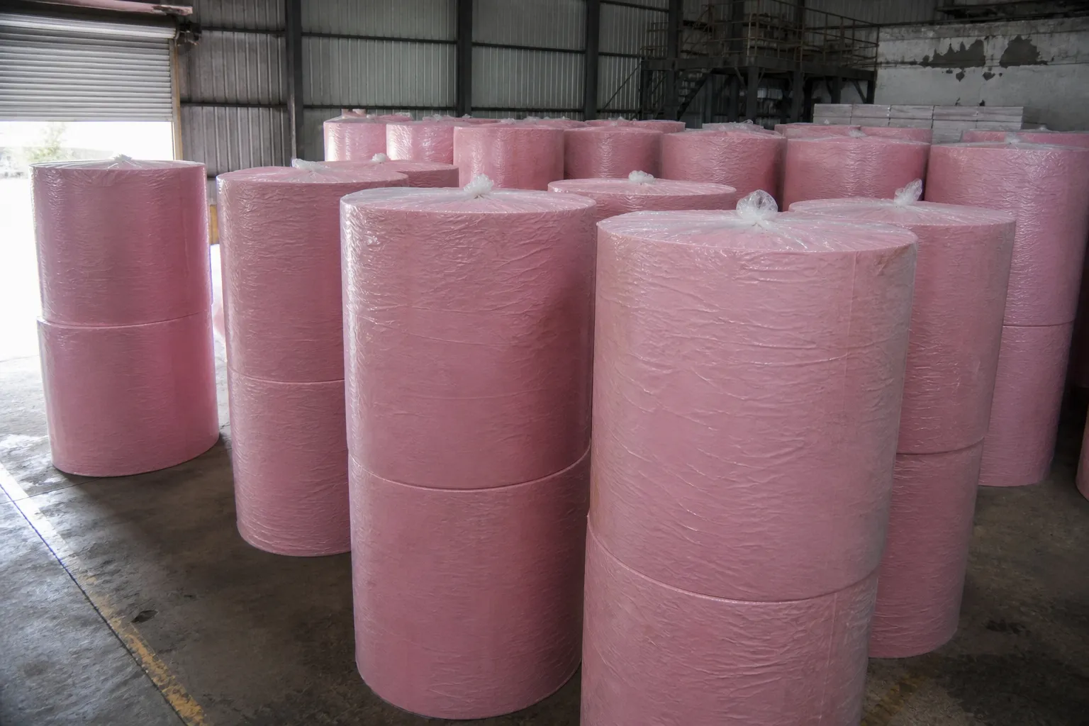 Pink toilet tissue jumbo roll for converting